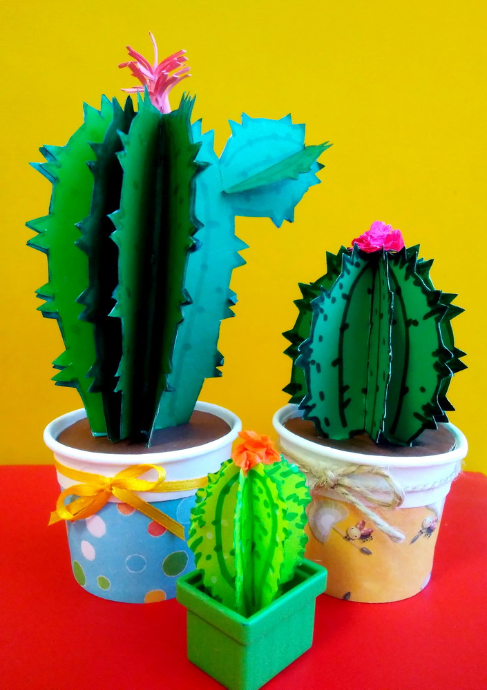 Cacti: a three-dimensional cardboard handicraft. Materials: cardboard, paper, glue, satin ribbon.